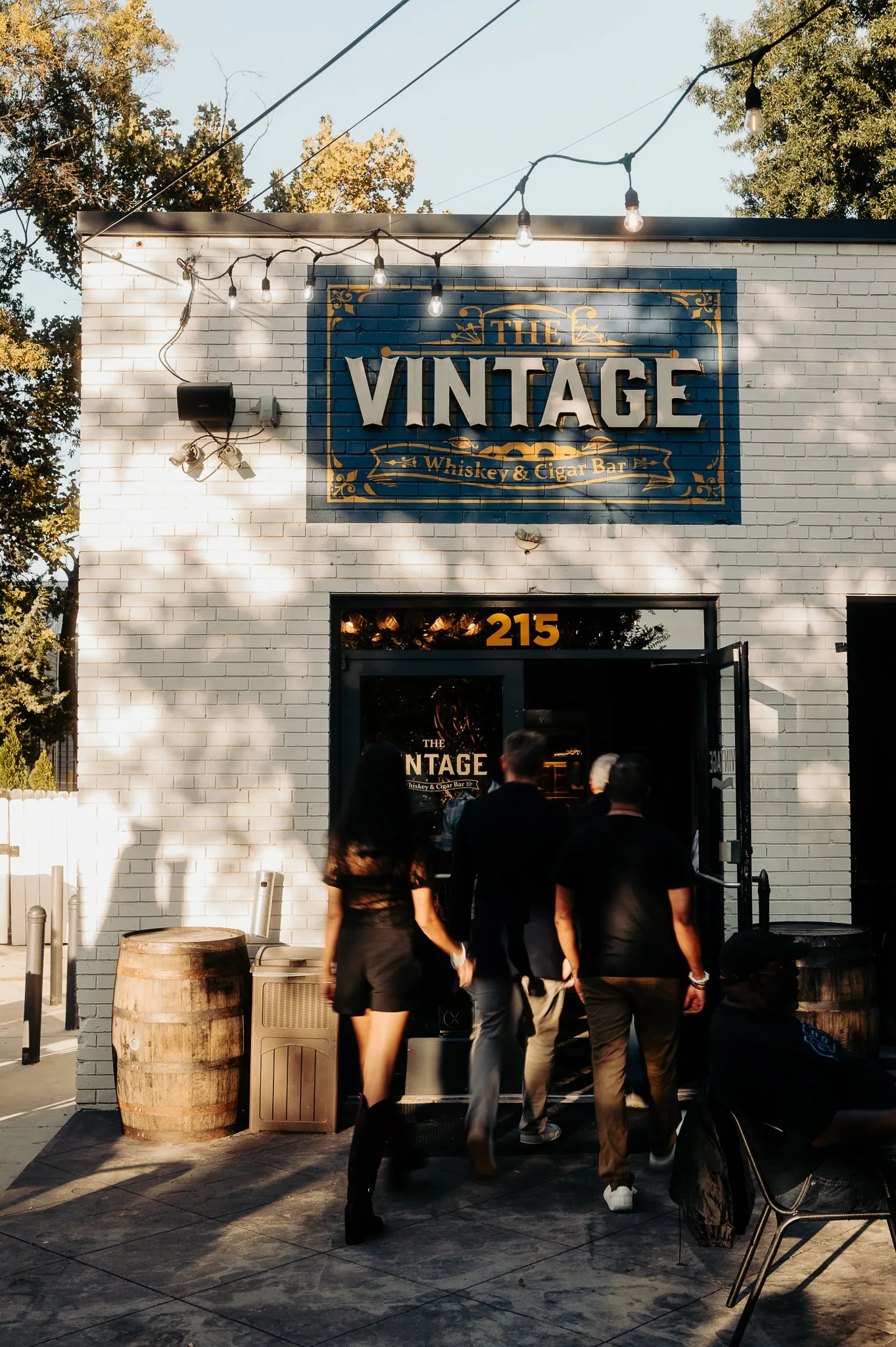 Guests arriving beneath The Vintage sign at 215 East Worthington Avenue